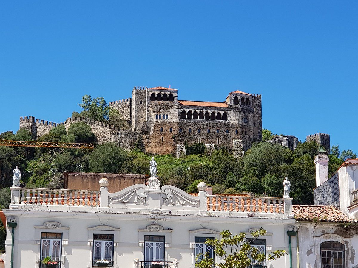 Leiria castle rising above the city rooftops